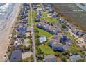 Aerial view showing community layout, pool, and proximity to beach at 11 Inlet Point Dr., Pawleys Island, SC 29585