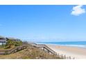 Oceanfront view with beach access steps at 11 Inlet Point Dr., Pawleys Island, SC 29585