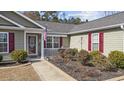 House exterior featuring a covered porch and well-maintained landscaping at 1460 Abberbury Dr., Conway, SC 29527
