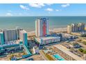 High-rise building near beach, showing surrounding buildings and pool at 1605 S Ocean Blvd. # 810, Myrtle Beach, SC 29577