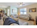 Bright and airy living room with comfortable sofas and large windows at 191 Ocean Commons Dr., Surfside Beach, SC 29575