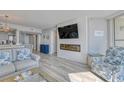 Living room with fireplace and built-in entertainment center at 1990 N Waccamaw Dr. # 1109, Garden City Beach, SC 29576