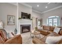 Inviting living room featuring fireplace, leather furniture, and neutral décor at 2004 Via Palma Dr., North Myrtle Beach, SC 29582