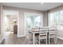 Bright dining room with hardwood floors and access to a back patio at 2065 Nw Parow Ln Nw # D, Calabash, NC 28467