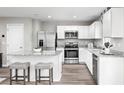 Modern kitchen with white cabinets, granite countertops, and stainless steel appliances at 265 Christiana Ln. # B, Myrtle Beach, SC 29579