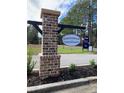 Forestbrook Townhomes brick sign, accented by lush landscaping, offers a charming welcome to the community at 265 Christiana Ln. # C, Myrtle Beach, SC 29579