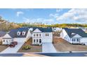 Community of two-story houses with gray siding and attached garages at 299 Empyrean Circle, Myrtle Beach, SC 29588