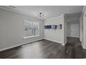 Bright dining room with dark hardwood floors at 4239 Villas Dr. # 609, Little River, SC 29566