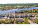 Condo community near waterway, showcasing location and landscaping at 4416 Eastport Blvd. # N15, Little River, SC 29566