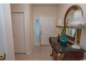Bright entryway with decorative console table and mirror at 4617 Lightkeepers Way # 9-I, Little River, SC 29566