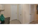Hallway with multiple doors and tile flooring at 4617 Lightkeepers Way # 9-I, Little River, SC 29566