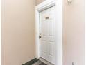 White front door with brass hardware and number 202 at 4773 Wild Iris Dr. # 5-202, Myrtle Beach, SC 29577