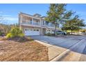 Two-story townhome with brick front and attached garage, ample parking at 502 Hay Hill Ln. # B, Myrtle Beach, SC 29579