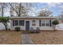Quaint beachfront cottage with a cozy front porch at 727 Cypress Dr., Surfside Beach, SC 29575