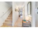 Bright entryway with staircase, mirror, and table at 775 Plantation Dr. # 48, Little River, SC 29566