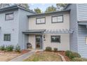 Front view of townhouse with landscaping and entrance at 775 Plantation Dr. # 48, Little River, SC 29566