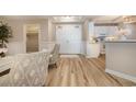 Bright condo entryway with light wood floors and access to kitchen at 8500 Margate Circle # 606, Myrtle Beach, SC 29572