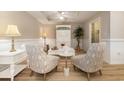 Cozy sitting area with two armchairs and a wood-like floor at 8500 Margate Circle # 606, Myrtle Beach, SC 29572