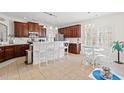 Bright kitchen with white island seating, stainless appliances, and dark cabinets, perfect for modern living at 113 Preservation Dr., Myrtle Beach, SC 29572