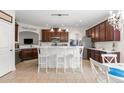 Well-lit kitchen featuring a breakfast bar, stainless steel appliances, and ample cabinet space for storage solutions at 113 Preservation Dr., Myrtle Beach, SC 29572
