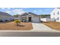Cozy one-story home featuring a tidy front yard and a convenient one-car garage at 141 Foxford Dr., Conway, SC 29526