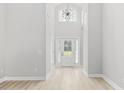 Bright and airy entryway with high ceilings and modern chandelier at 1727 Cane Branch Rd., Loris, SC 29569
