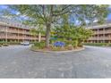 Community entrance with landscaping and building view at 180 Rothbury Circle # 215, Myrtle Beach, SC 29572