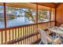 Screened balcony overlooking a lake with seating area at 180 Rothbury Circle # 215, Myrtle Beach, SC 29572