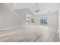 Spacious living room with vaulted ceilings and sliding glass doors at 1900 Blue Bird Rd., Loris, SC 29569