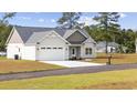 Newly built home with a two-car garage and spacious yard at 1904 Blue Bird Rd., Loris, SC 29569