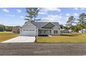 Charming one-story house with a two-car garage at 1904 Blue Bird Rd., Loris, SC 29569