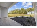 Covered front porch with a view of the neighborhood at 1904 Blue Bird Rd., Loris, SC 29569