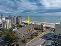 Aerial view showcasing oceanfront location and nearby buildings at 202 75Th Ave. N # 5604/5605, Myrtle Beach, SC 29572