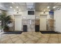 Building lobby with elevators, tiled floors, and potted plant at 210 75Th Ave. N # 4141, Myrtle Beach, SC 29572