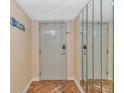 Bright condo entry with wood floors and mirrored walls at 2511 S Ocean Blvd. # 1601, Myrtle Beach, SC 29577