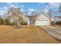 One-story house with attached garage and manicured lawn at 3914 Glenmere Dr., Myrtle Beach, SC 29588
