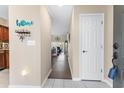 Inviting entryway with neutral walls, ceramic tile floors, and decorative touches creating a warm welcome at 4396 Baldwin Ave. # 34, Little River, SC 29566