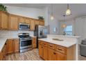 Modern kitchen features stainless steel appliances, granite countertops, and ample cabinet space at 502 Castellar Ln., Little River, SC 29566