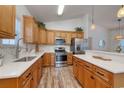 Modern kitchen features stainless steel appliances, granite countertops, and ample cabinet space for culinary enthusiasts at 502 Castellar Ln., Little River, SC 29566