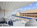 Outdoor balcony featuring comfortable seating and views of the pool and ocean at 5511 N Ocean Blvd. # 302, Myrtle Beach, SC 29577