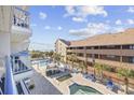 A pool with lounge chairs at a beautiful condo at 5511 N Ocean Blvd. # 302, Myrtle Beach, SC 29577
