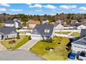 Aerial view of charming house in a quiet neighborhood with lush green lawns at 626 Notting Hill Ct., Conway, SC 29526