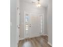 Bright entryway with a white door, wood-look flooring, and access to other rooms at 643 Woodside Dr., Conway, SC 29526