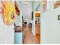 Inviting entryway with hardwood floors, stylish console table, and view into the living spaces at 6716 Wisteria Dr., Myrtle Beach, SC 29588