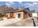 Ranch style home with a brick exterior and detached shed at 804 Geddings Dr., Myrtle Beach, SC 29588