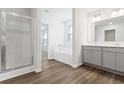 Main bathroom boasts double sinks, a soaking tub, and a shower at 1032 Kinness Dr., Conway, SC 29527