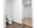Small bathroom with toilet and access to a spacious closet at 1032 Kinness Dr., Conway, SC 29527