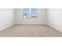 Simple carpeted bedroom with two windows and neutral walls at 1032 Kinness Dr., Conway, SC 29527