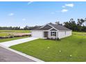 Newly built house with a large yard and driveway, viewed from above at 1036 Kinness Dr., Conway, SC 29527