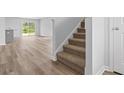 Modern stairs with brown carpet leading to the upper level at 1041 Kinness Dr., Conway, SC 29527